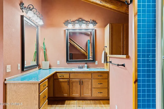 a living room with furniture a flat screen tv and a large window