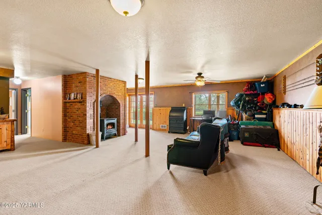 a view of a livingroom with furniture and a flat screen tv