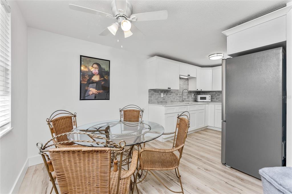 470 South McCall Road, Unit 10 Englewood, FL 34223 - Photo 15 of 57 a dining room with furniture and window