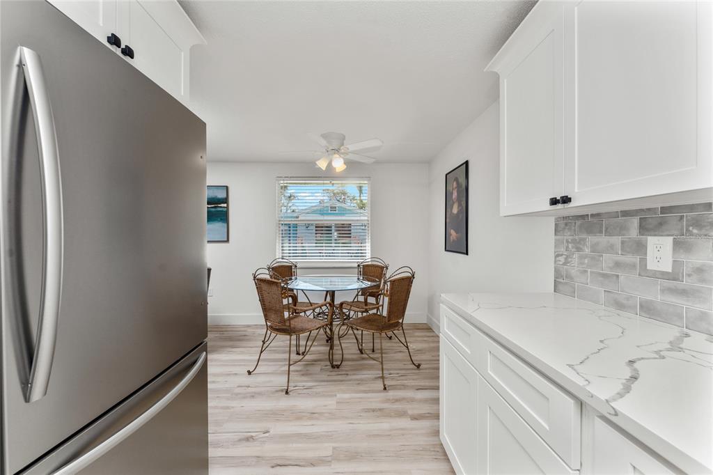 470 South McCall Road, Unit 10 Englewood, FL 34223 - Photo 18 of 57 a dining room with furniture and window