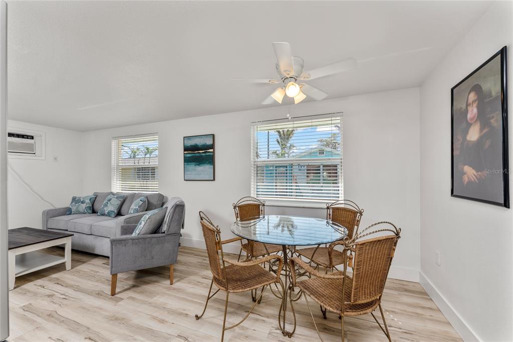470 South McCall Road, Unit 10 Englewood, FL 34223 - Photo 19 of 57 a living room with furniture and a wooden floor