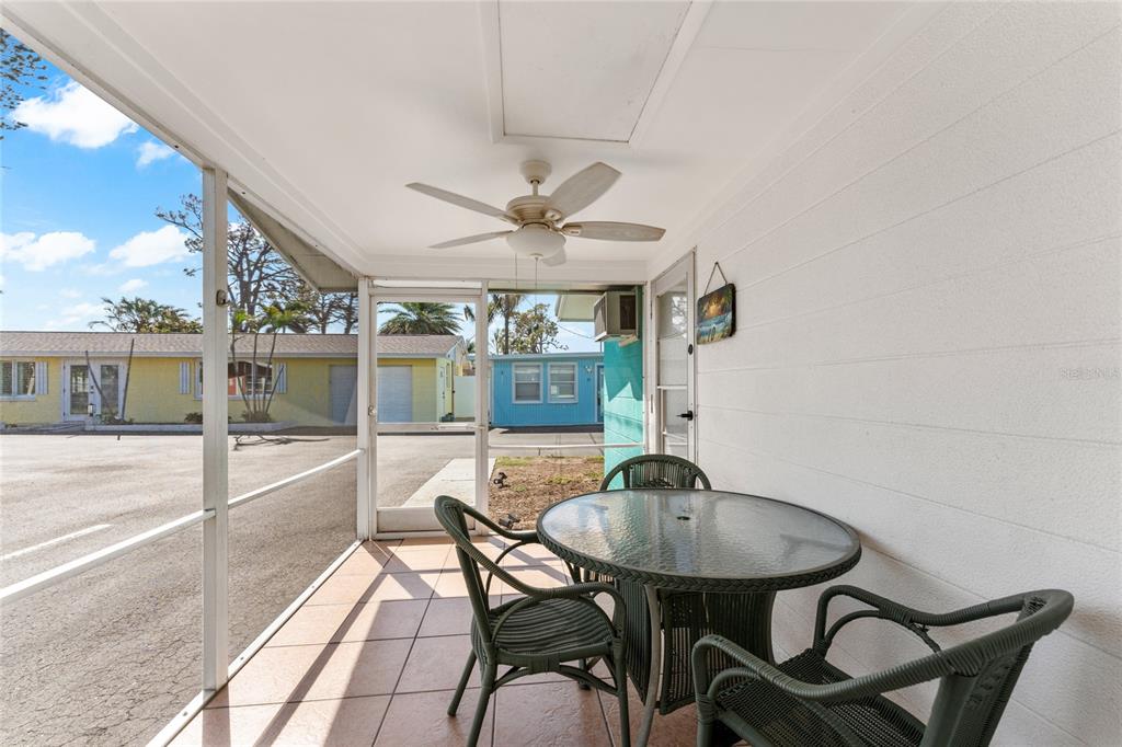 470 South McCall Road, Unit 10 Englewood, FL 34223 - Photo 26 of 57 a view of a dining room with furniture and wooden floor