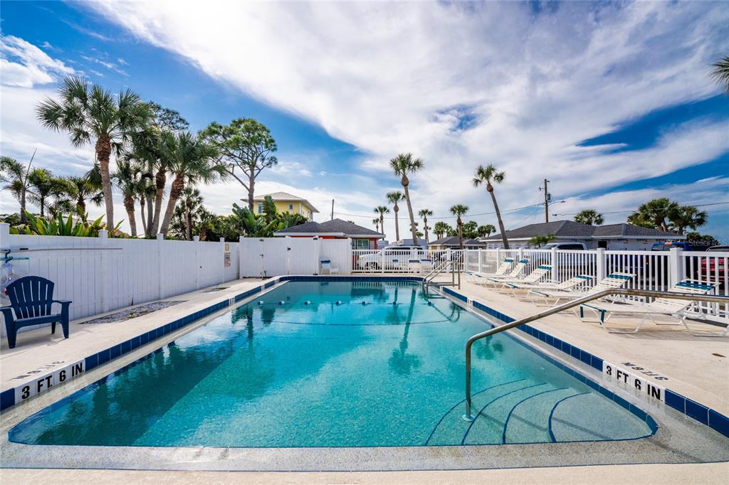 470 South McCall Road, Unit 10 Englewood, FL 34223 - Photo 3 of 57 a view of a swimming pool with a chair