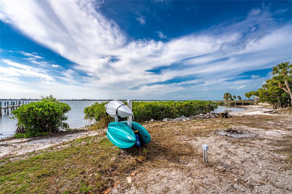 470 South McCall Road, Unit 10 Englewood, FL 34223 - Photo 34 of 57 a view of a dry yard with wooden fence