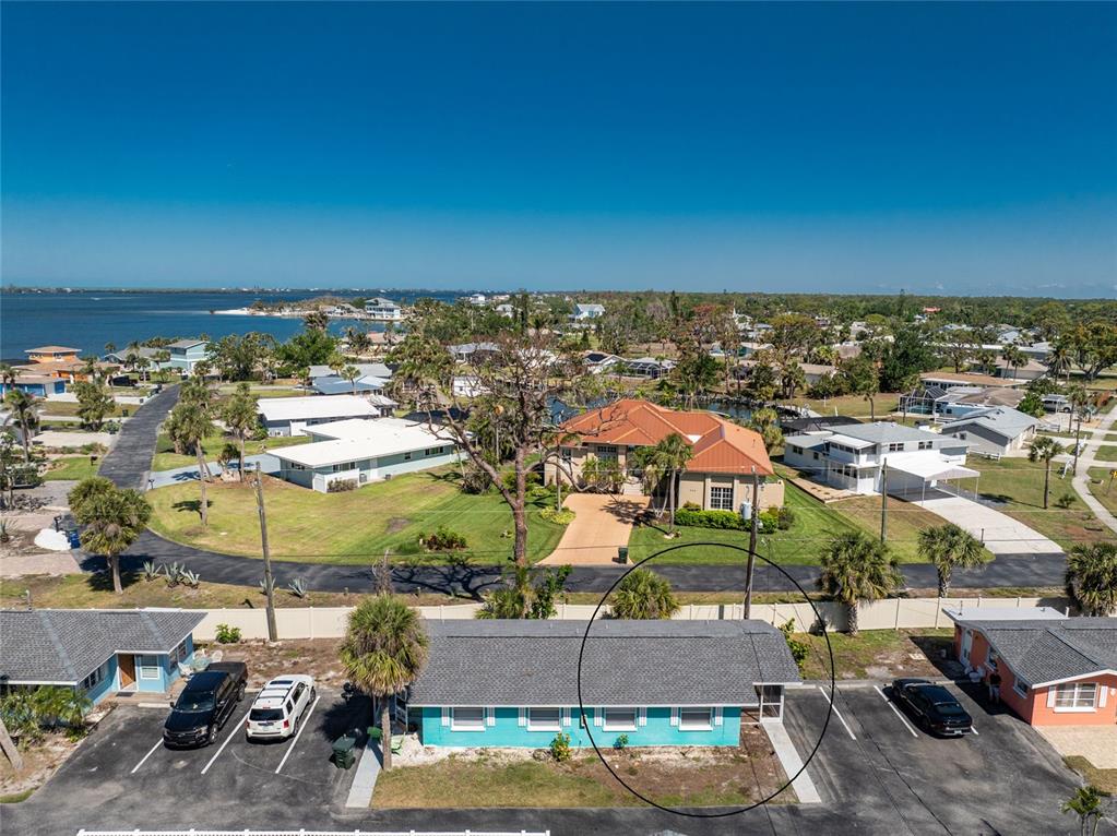 470 South McCall Road, Unit 10 Englewood, FL 34223 - Photo 42 of 57 an aerial view of a building with outdoor space