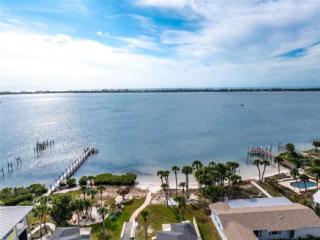 470 South McCall Road, Unit 10 Englewood, FL 34223 - Photo 56 of 57 an aerial view of a house with a lake view