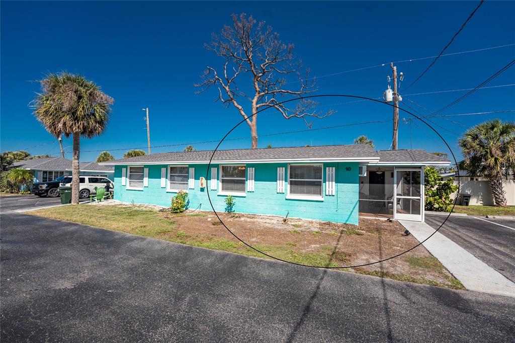 470 South McCall Road, Unit 10 Englewood, FL 34223 - Photo 9 of 57 a view of a house with backyard and patio