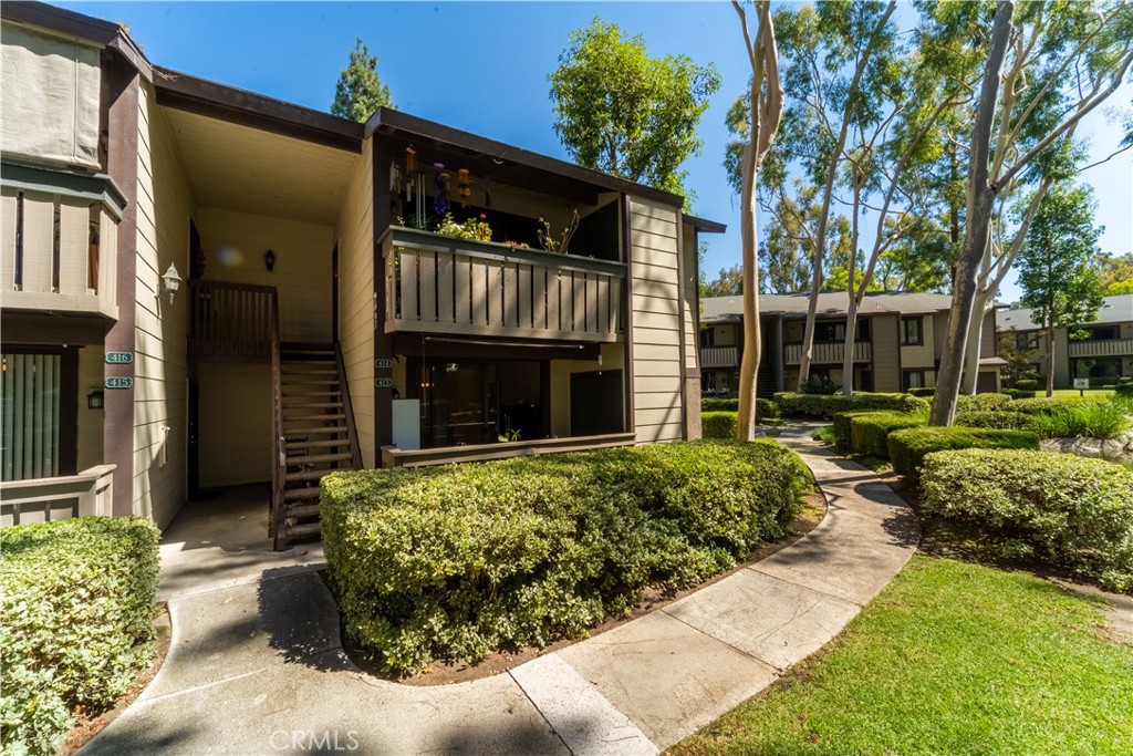 20702 El Toro Road, Unit 413 Lake Forest, CA 92630 - Photo 1 of 29 a front view of a house with garden