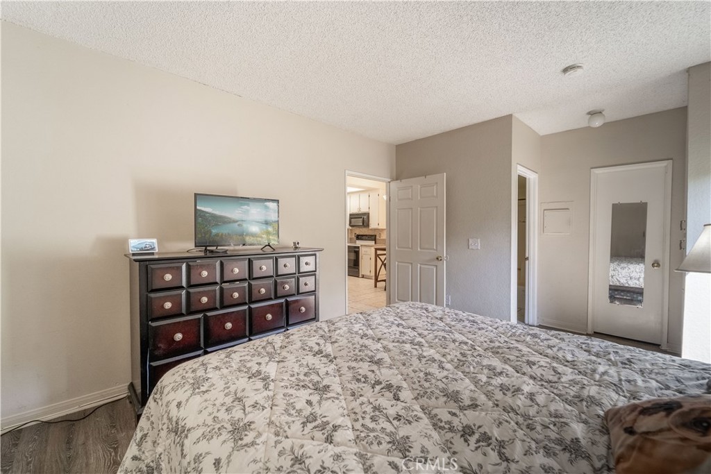 20702 El Toro Road, Unit 413 Lake Forest, CA 92630 - Photo 12 of 29 a bedroom with a bed and a dresser