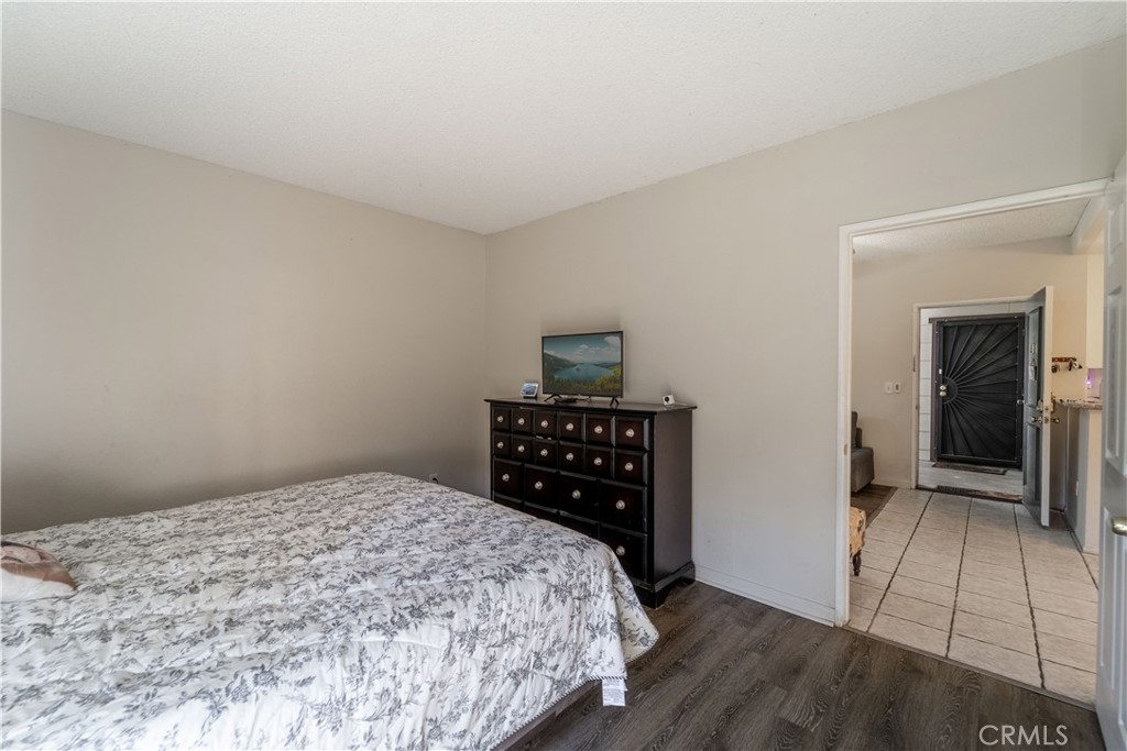 20702 El Toro Road, Unit 413 Lake Forest, CA 92630 - Photo 13 of 29 a bedroom with a bed and a cabinets