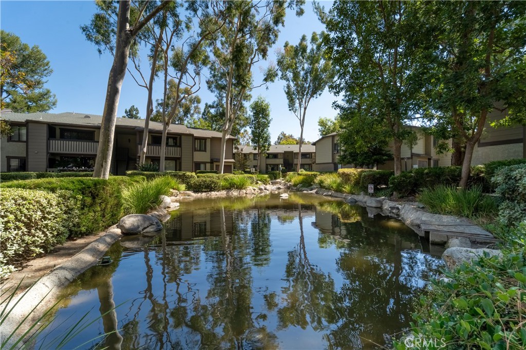 20702 El Toro Road, Unit 413 Lake Forest, CA 92630 - Photo 17 of 29 a view of residential house with outdoor space and lake view