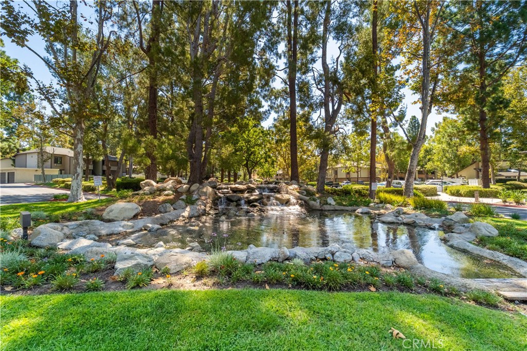 20702 El Toro Road, Unit 413 Lake Forest, CA 92630 - Photo 19 of 29 a view of a lake with houses