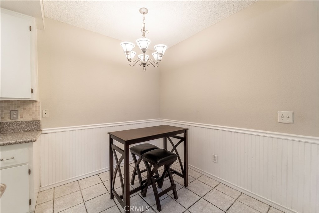 20702 El Toro Road, Unit 413 Lake Forest, CA 92630 - Photo 9 of 29 a view of a hallway with chandelier