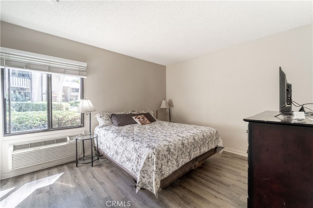 20702 El Toro Road, Unit 413 Lake Forest, CA 92630 - Photo 10 of 29 a bedroom with a bed and window