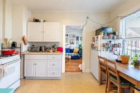 a kitchen with a sink appliances and cabinets