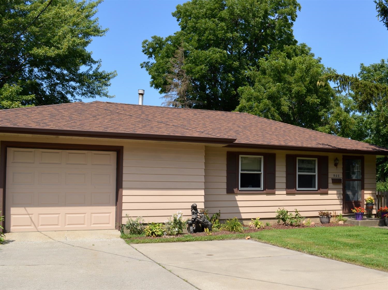 a front view of a house with garage