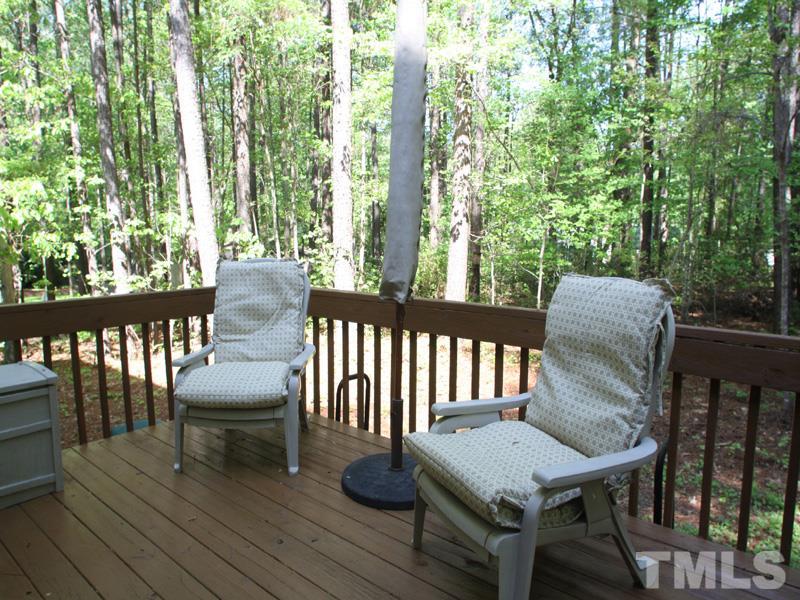 6017 Bur Trail Raleigh, NC 27616 - Photo 22 of 25 a view of a chairs and table on the deck