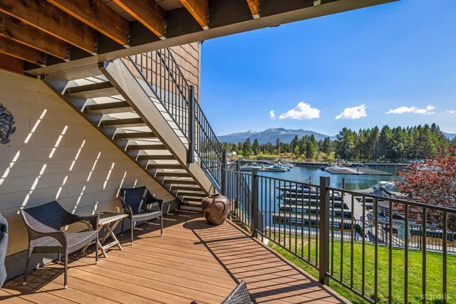 a view of balcony with wooden floor and outdoor seating