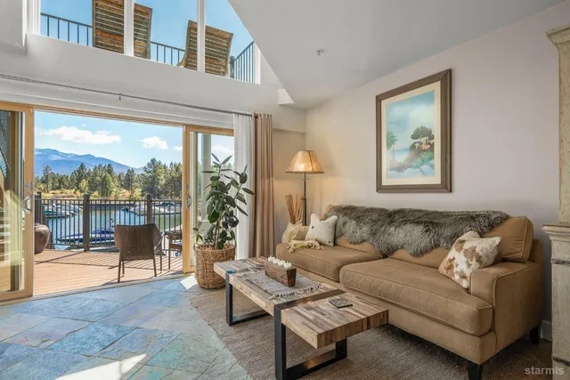 a living room with furniture a window and a fireplace