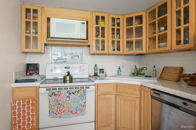 a bedroom with bed and wooden floor