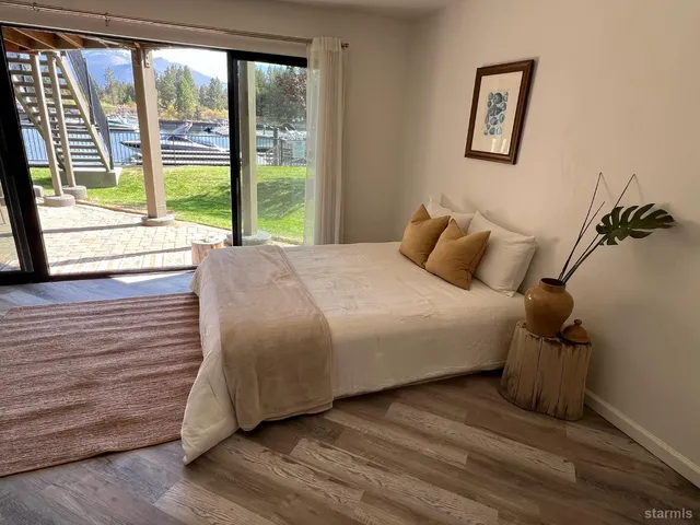 a view of a lake with lawn chairs