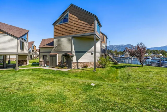an aerial view of a house with a mountain view