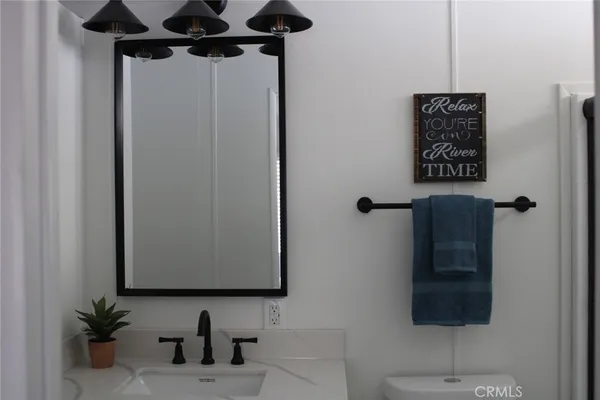 a bathroom with a shower and a mirror