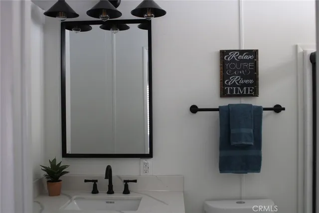 a bathroom with a shower and a mirror