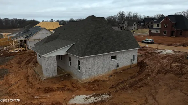 a view of a back yard of the house