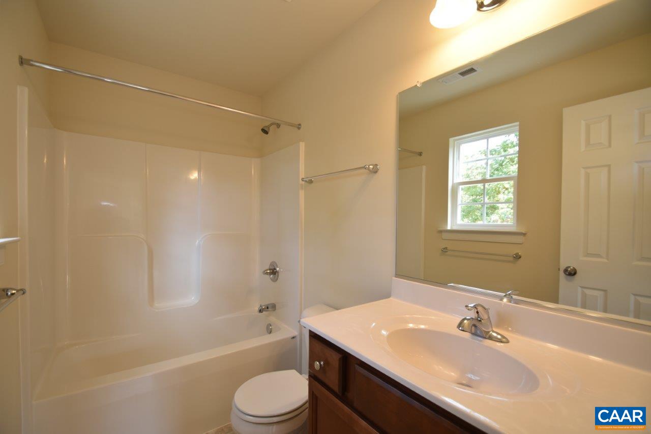 24 Haversack Road, Unit LOT 373 Palmyra, VA 22963 - Photo 11 of 15 a bathroom with a sink toilet tub and shower
