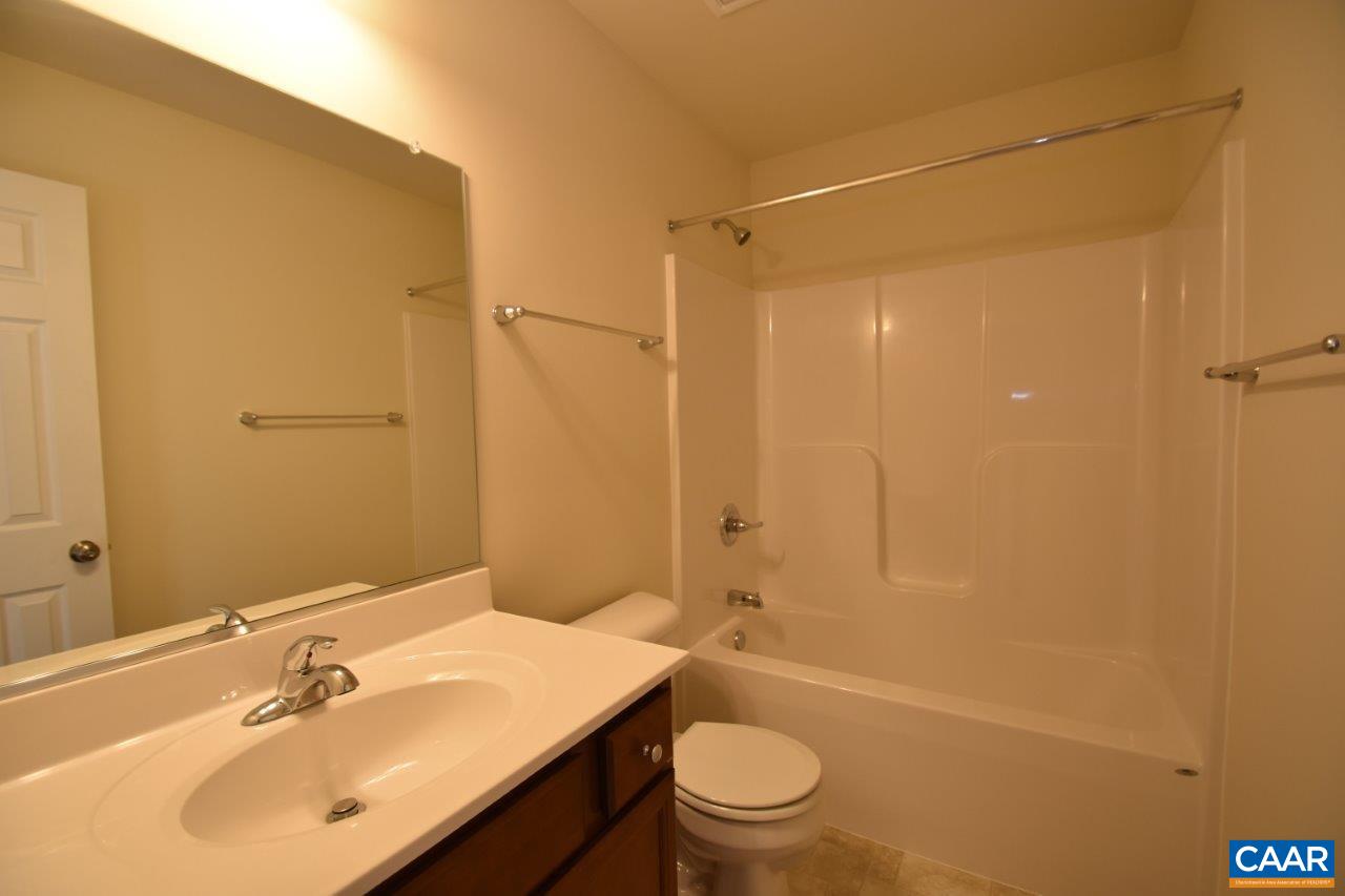 24 Haversack Road, Unit LOT 373 Palmyra, VA 22963 - Photo 15 of 15 a bathroom with a sink a toilet and shower