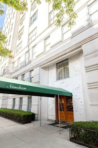 a front view of a building with garden