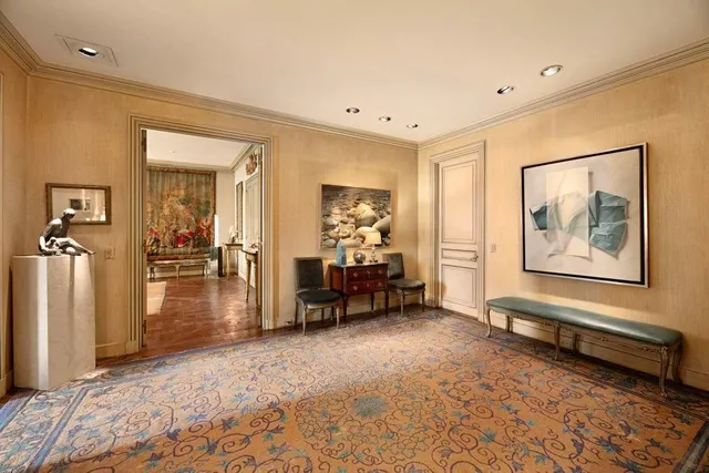 a view of livingroom with furniture and a rug