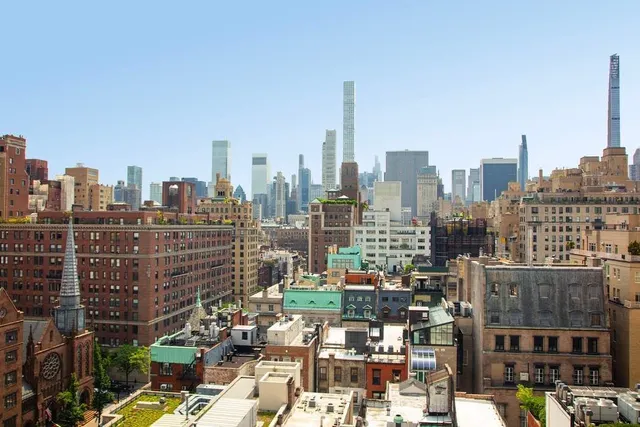 a view of a city with tall buildings