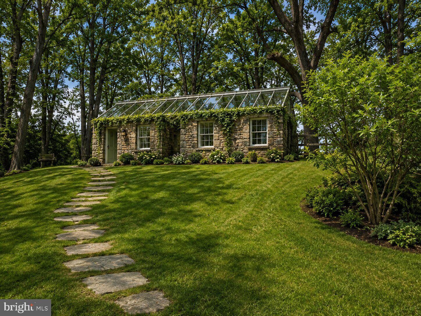 1475 Langhorne Yardley Road Langhorne, PA 19047 - Photo 6 of 15 Charming stone cottage amid lush greenery.