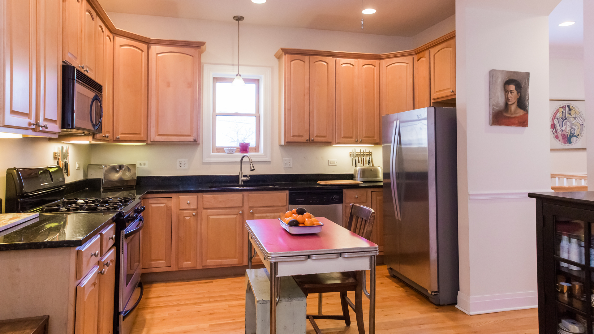 6963 North Sheridan Road, Unit 1E Chicago, IL 60626 - Photo 11 of 20 a kitchen with stainless steel appliances a stove refrigerator sink and cabinets