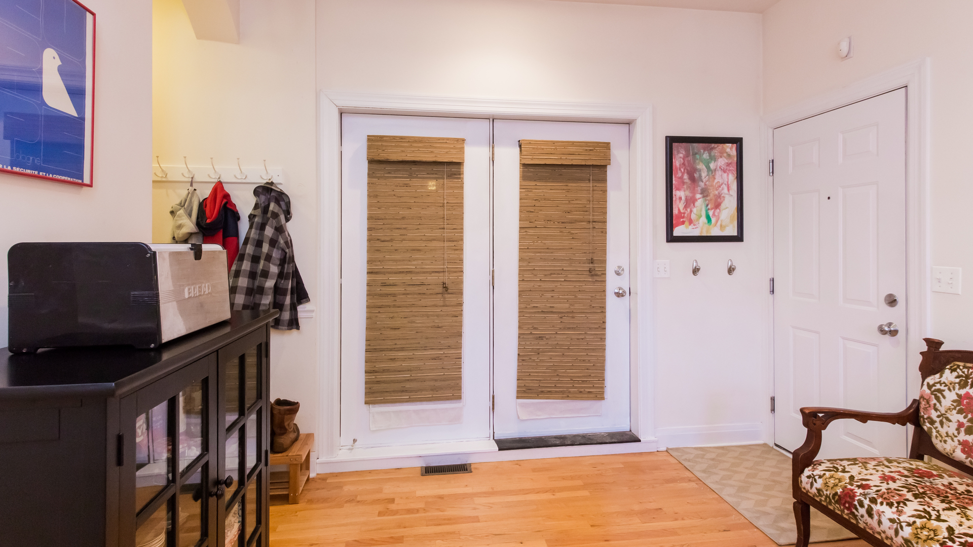 6963 North Sheridan Road, Unit 1E Chicago, IL 60626 - Photo 12 of 20 a view of an entryway with wooden floor and livingroom
