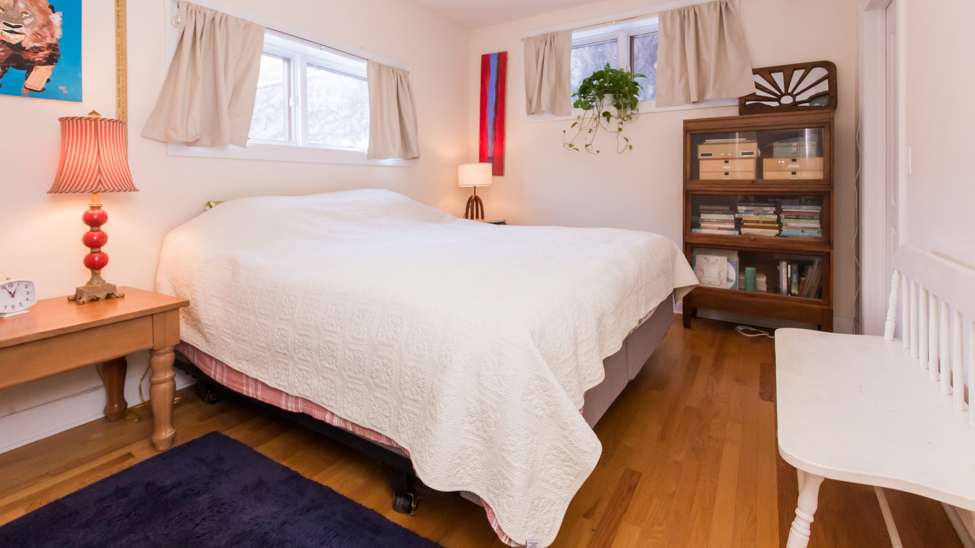 6963 North Sheridan Road, Unit 1E Chicago, IL 60626 - Photo 16 of 20 a bed sitting in a bedroom next to a window