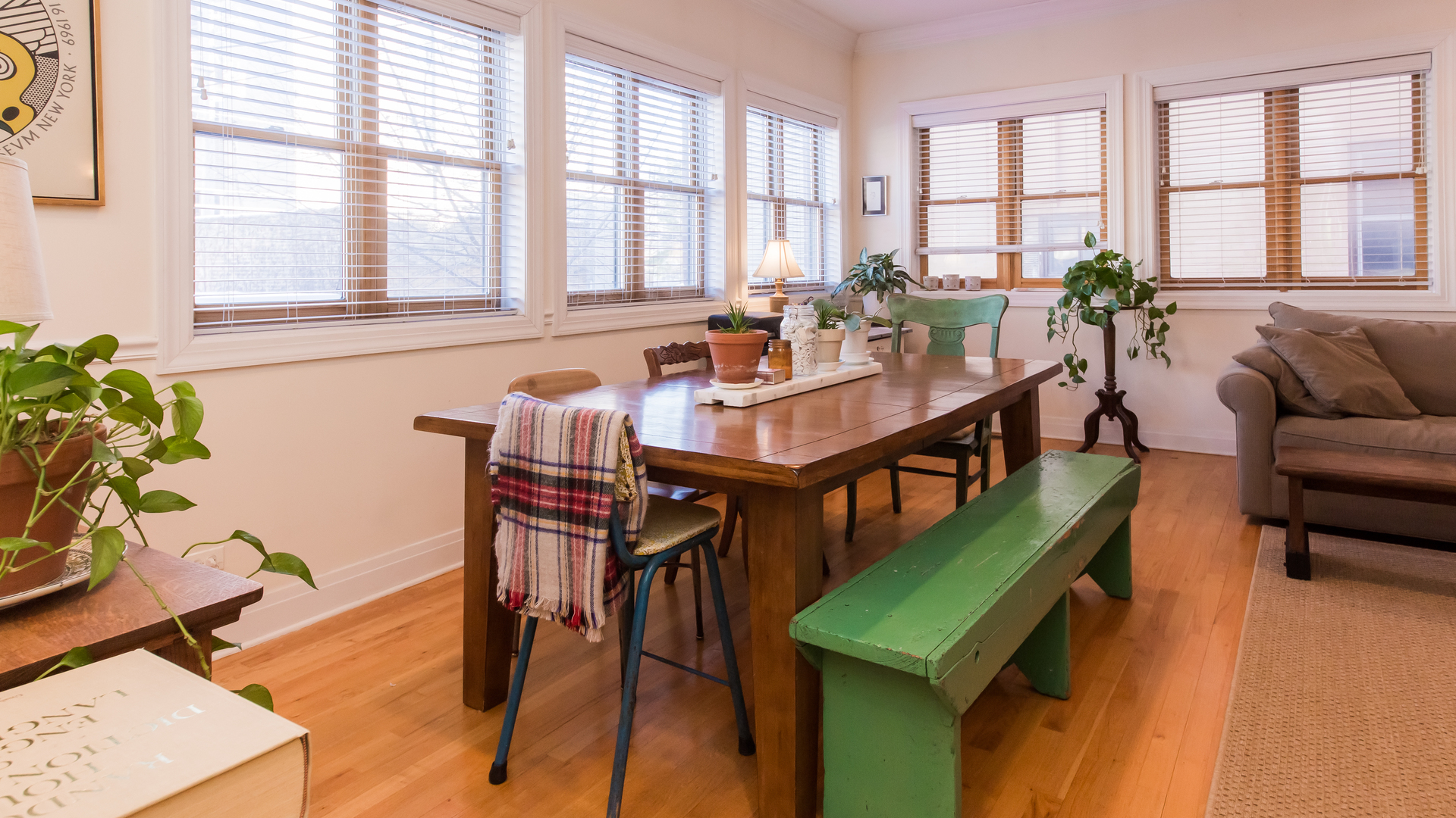 6963 North Sheridan Road, Unit 1E Chicago, IL 60626 - Photo 8 of 20 a dining room with furniture window and wooden floor