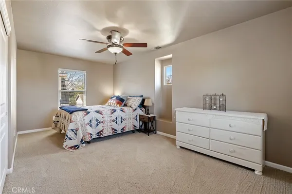 a bedroom with bed and window