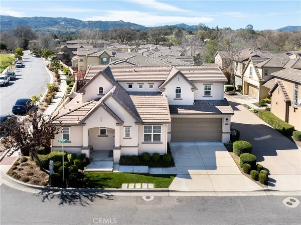 an aerial view of residential houses and outdoor space