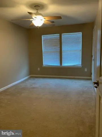 a view of room with fan and window