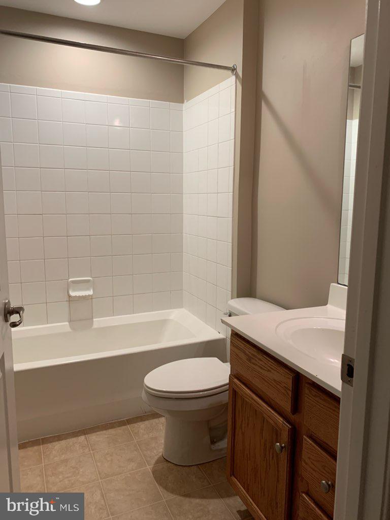 36405 Ridgeshore Lane Millville, DE 19967 - Photo 17 of 22 a bathroom with a sink a toilet and a bathtub