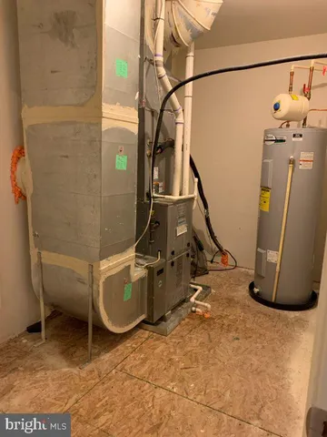 a room with water heater and storage