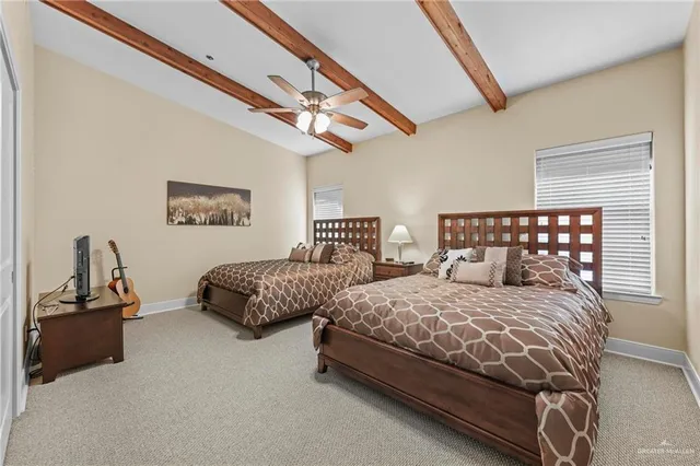 a bathroom with double vanity sink and a mirror