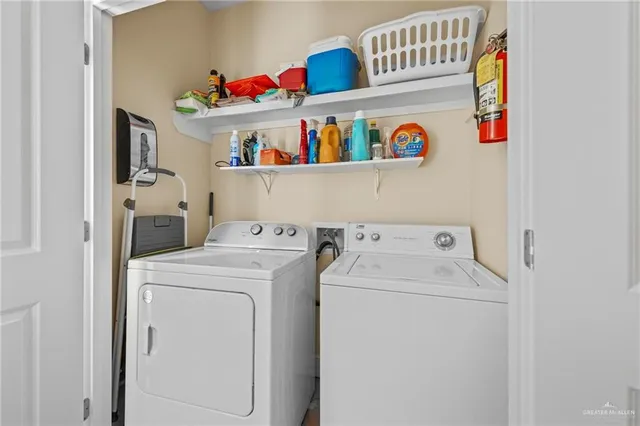 a bathroom with a granite countertop sink a mirror and a toilet
