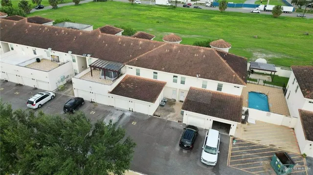 an aerial view of a house with outdoor space patio and lake view