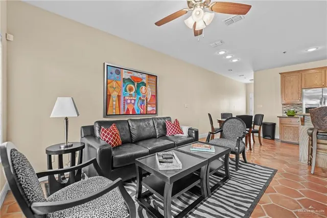 a living room with furniture a dining table and a piano