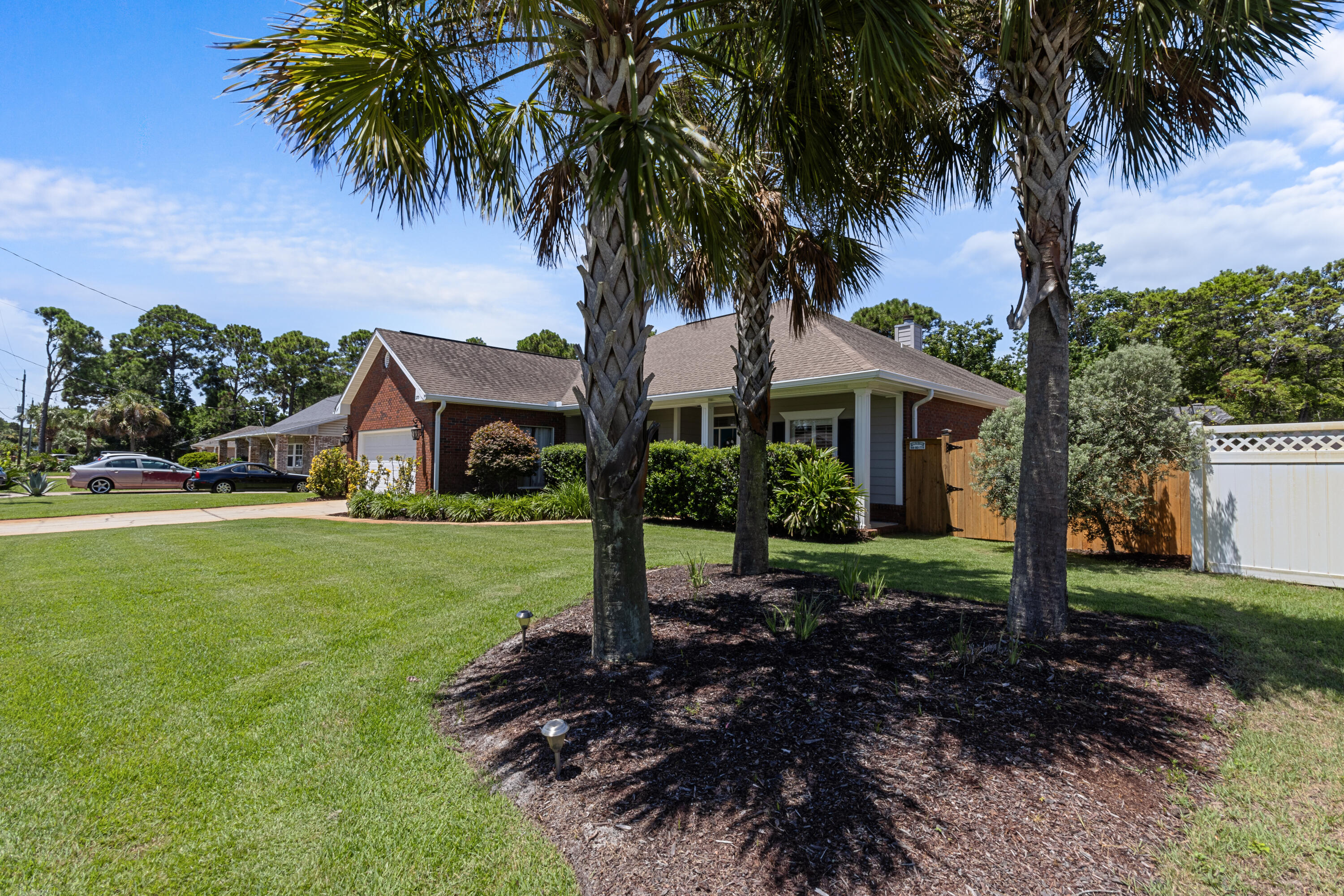 379 North Holiday Road Miramar Beach, FL 32550 - Photo 2 of 76 3 Mature Palm Trees