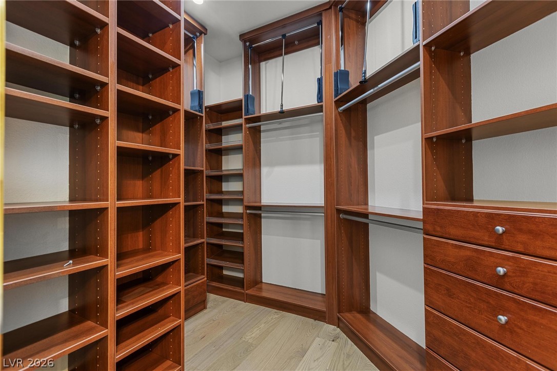 11425 Rancho Portena Avenue Las Vegas, NV 89138 - Photo 36 of 58 Walk in closet featuring light wood finished floors